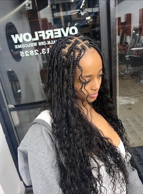 Detailed feed-in cornrows with clean parts styled at Braids Master LA in Los Angeles