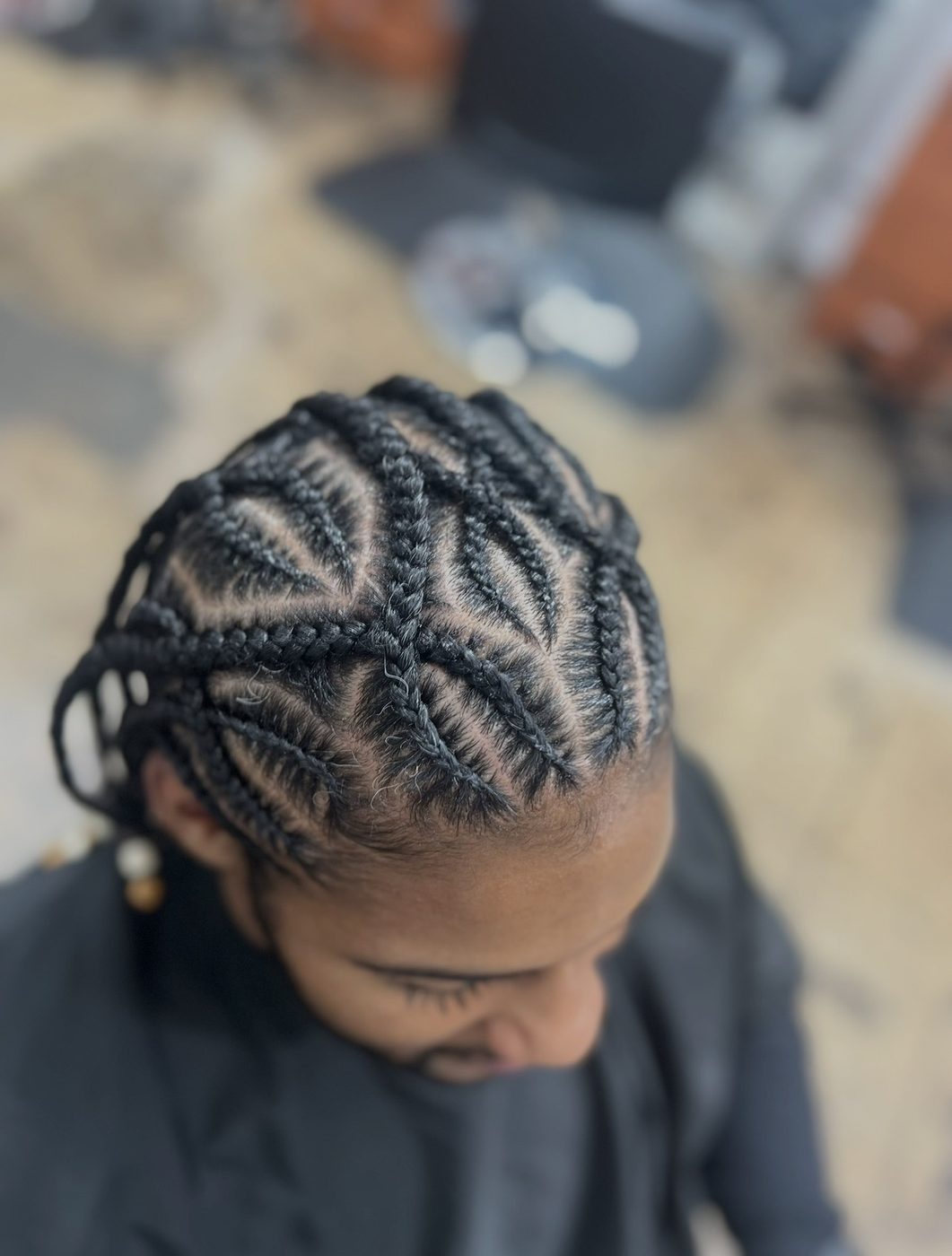 Locs retwist with braided roots styled at Braids Master LA in Los Angeles